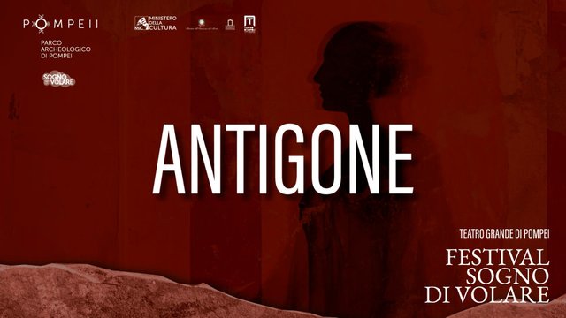 Title card of the film «Antigone»: a female figure backlit against a red ground