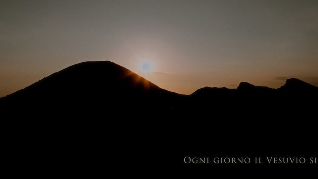 Still from the film on Vesuvius National Park: the sun rising behind the profile of the volcano